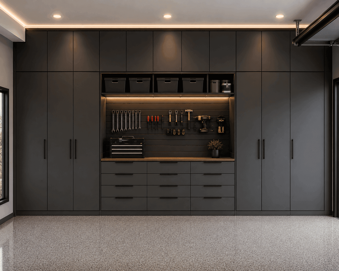 Organized garage storage system with cabinets by Cumming Closets